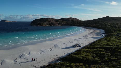 People-walking-over-the-white-sands-of-Lucky-bay-beach-in-western-australia