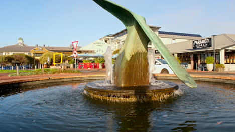 Whale-tail-fountain-landmark-in-Hermanus-waterfront,-golden-hour-morning-shot