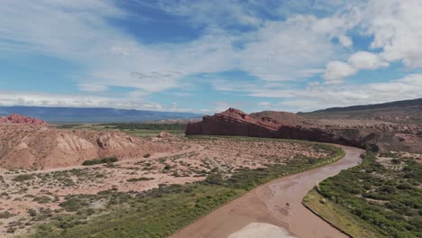 Stunning-aerial-view-of-Quebrada-de-las-Conchas-in-Cafayate,-Argentina-under-a-vibrant-blue-sky