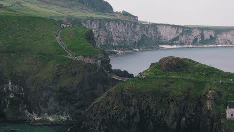 Aerial-Circling-Shot-of-Carrick-a-Rede-Rope-Bridge-in-Northern-Ireland