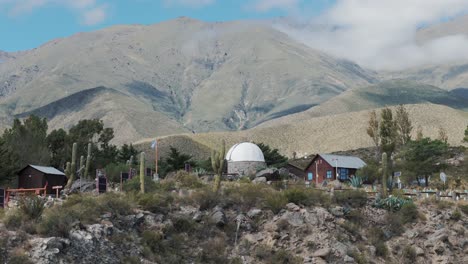 Aerial-view-above-astromical-observatory-in-Amaicha-del-Valle,-Argentina-with-majestic-mountain-landscape