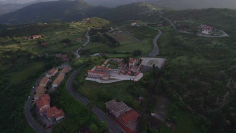 Aerial-orbit-Italian-cemetery-surrounded-by-green-countryside