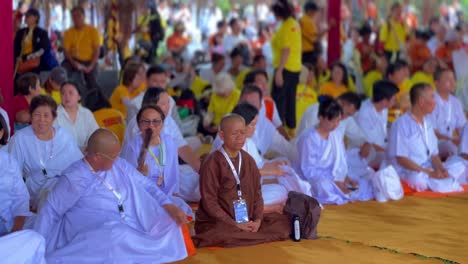 Monks-in-Vesak-procession-on-hot-day,-front-view