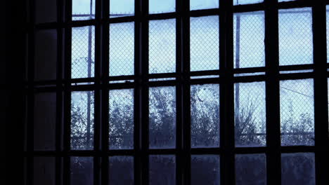 Alcatraz-Prison-Window-With-Metal-Bars-and-High-Fence,-Inside-View,-California-USA