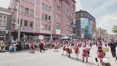 Happy-Asian-spectator-at-Rose-festival-receives-garland-of-pink-flowers