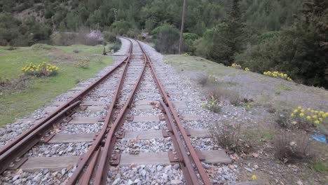 Old-Train-Tracks-At-An-Old-Railway-Station-In-Peloponnese,-Greece---Drone-Shot