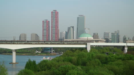 Dangsan-Railway-Bridge-And-Han-River-With-Cityscape-In-The-Background-In-Seoul,-South-Korea