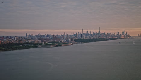 NYC-New-York-Aerial-v249-panoramic-panning-view-drone-flyover-Hudson-River-capturing-cityscape-of-Upper-Manhattan-and-Edgewater-in-New-Jersey-at-sunset---Shot-with-Inspire-3-8k---September-2023