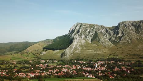 Stunning-rocky-mountain-behind-the-iconic-village-Rimetea,-also-known-as-Torocko