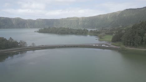 The-serene-sete-cidades-lagoon-surrounded-by-lush-greenery-in-portugal,-aerial-view