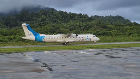 Airswift-Airlines-ATR-Airplane-on-Runway-of-El-Nido-Airport,-Palawan-Island,-Philippines