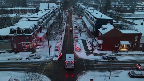 Ambulance-on-main-road-of-small-city-in-winter