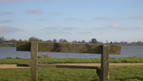 Weathered-Wooden-Bench-At-Castletown-River-Near-Drogheda-City,-Ireland