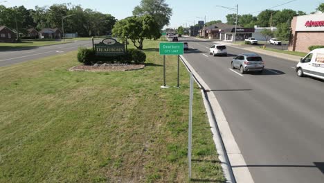 Welcome-to-Dearborn,-Michigan-sign-and-Dearborn,-Michigan-city-limit-sign-with-drone-video-moving-in