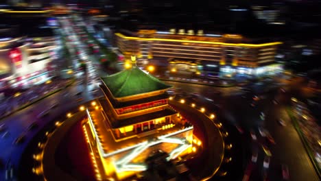 Nighttime-view-of-illuminated-Bell-Tower-in-Xi'an-with-surrounding-city-lights,-China