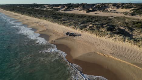 Off-road-vehicles-and-people-on-Preston-Beach,-Yalgorup-National-Park-in-Western-Australia