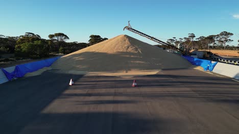 Aerial-approaching-shot-of-grain-bulk-transported-by-pipeline