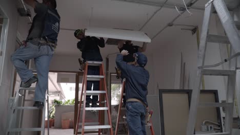 Mexican-men-work-on-construction-sites-and-office-electrical-installation