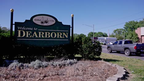 Welcome-to-Dearborn,-Michigan-sign-with-stable-video-low-and-traffic-in-background