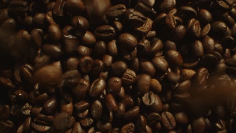 A-detailed-close-up-image-of-roasted-coffee-beans,-showcasing-their-rich-brown-color-and-textured-surface