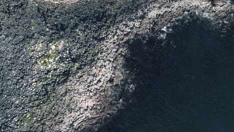 Birdseye-View-of-Giant's-Causeway-with-Waves-and-People