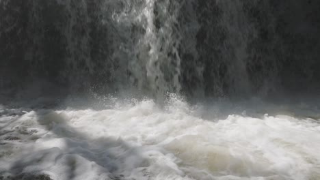 Powerful-waterfall-cascades-into-a-pool-in-Owen-Sound,-Canada,-creating-a-dramatic-and-serene-scene