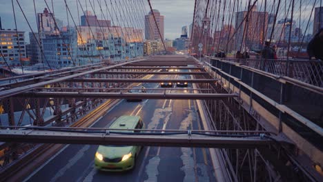 Brooklyn-Bridge-Roadway-With-Cars-And-Walking-Path-With-People