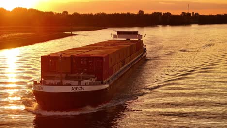 Beautiful-sunrise-sky,-goods-transportation,-vessel-movement,-aerial