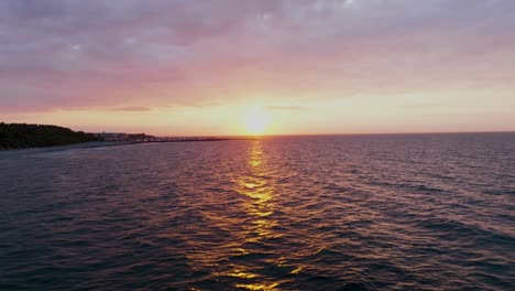 The-sea-at-sunset--flying-low