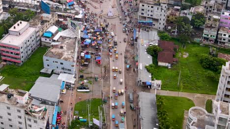 High-Aerial-View-of-Barisal-City-Road-Amid-Heavy-Traffic-Near-a-Bus-Station-in-Bangladesh