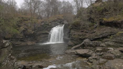 Wide-angle-shot-of-the-rugged-landscape-at-the-Falls-of-Falloch-in-Scotland