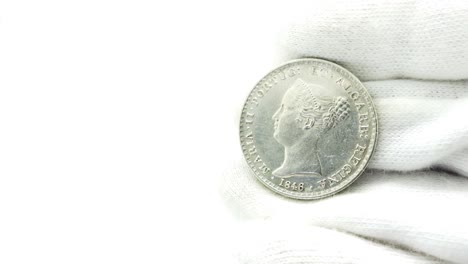 Numismatist-in-White-Gloves-Looking-at-Old-Coin-05