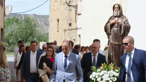 People-Carrying-A-Statue-Of-Jesus-Christ-In-A-Street,-Spain