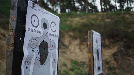 Paper-target-with-human-silhouette-on-Olesko-shooting-range-wooden-stand