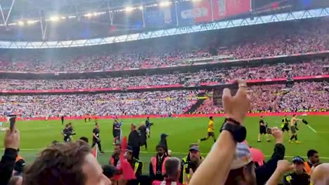 Crowds-celebrating-before-Southampton-and-Leeds-play-in-Wembley,-London,-United-Kingdom