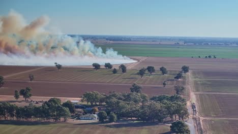 Farm-fields-with-smoke-billowing-from-a-planned-agricultural-fire