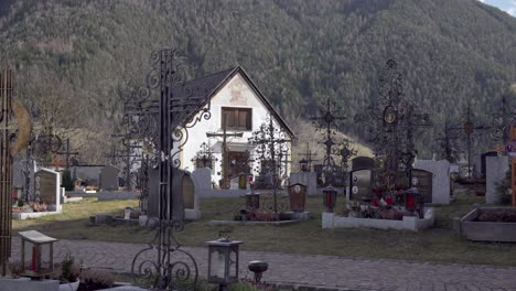 The-village-cemetery-with-graves-in-the-shade-of-Vill---Rodeneck,-Villa---Rodengo,-South-Tyrol,-Italy