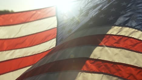 Closeup-of-American-flag-in-sunlight-in-cinematic-slow-motion-blowing-in-wind