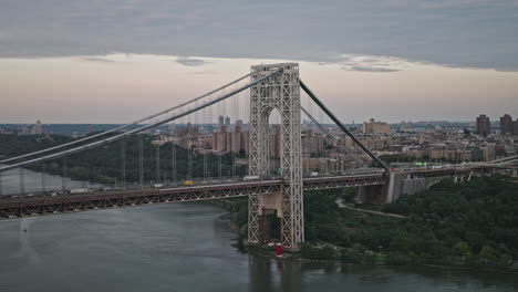 NYC-New-York-Aerial-v248-drone-flyover-capturing-traffic-on-George-Washington-Bridge-over-Hudson-river,-cityscape-of-Washington-Heights-in-Upper-Manhattan---Shot-with-Inspire-3-8k---September-2023