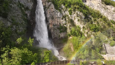 Close-up-aerial-view-of-the-magnificent-Seerenbachfälle-waterfalls,-capturing-the-powerful-flow-of-water-against-the-rugged-cliffs