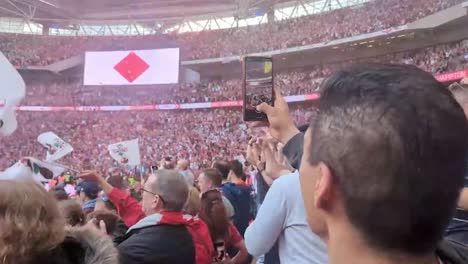 Videos-on-the-phones-of-Southampton-vs-Leeds-in-Webley,-London,-United-Kingdom