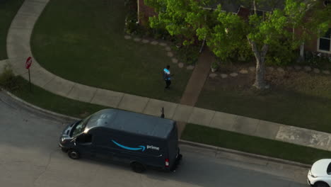 An-Amazon-Prime-van-making-a-delivery-to-a-house-in-a-suburban-neighborhood