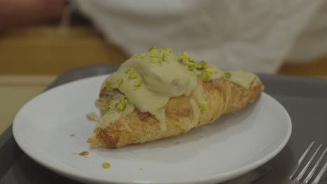 Tasty-Croissant-enhanced-with-a-savory-condiment-in-the-foreground