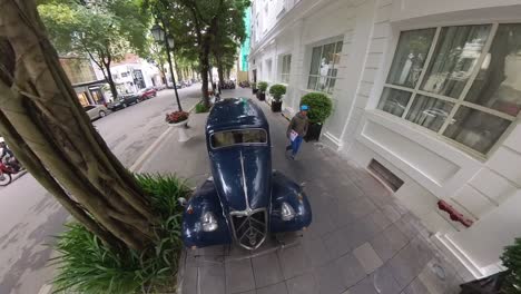 Vintage-car-in-Hanoi-Opera-House-city-park-with-a-large-number-of-trees