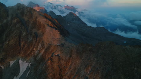 Picturesque-view-over-rocky-mountains-peak-at-dusk