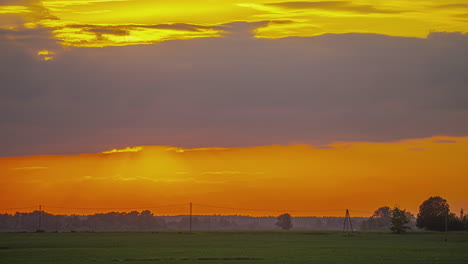 Red-Sunset-time-lapse-day-to-night-transition-over-rural-field-central-Europe