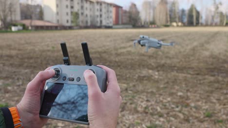 Drone-User-Using-Controller-To-Pilot-Done-In-Field