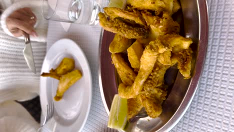 close-view-of-plate-of-fried-cuttlefish-typical-of-the-city-of-Setubal