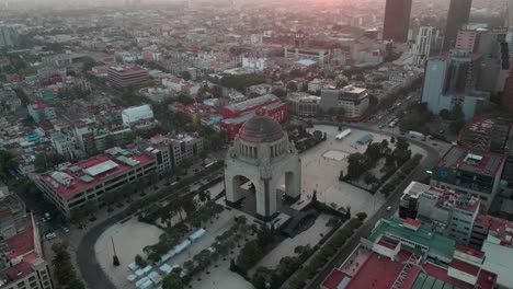 Aerial-Drone-Pull---Monument-to-the-Revolution-Dome---Plaza-de-la-República---Mexico-City,-Mexico---Sunset-Sunrise