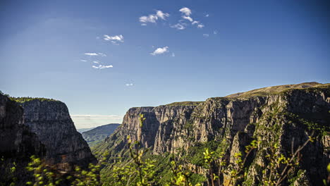 High-angle-shot-of-Vikos-Gorge,-a-gorge-in-the-Pindus-Mountains-of-northern-Greece,-lying-on-the-southern-slopes-of-Mount-Tymfi-in-Zagori-region,-Greece-at-daytime